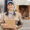 delivery woman holding a weed package