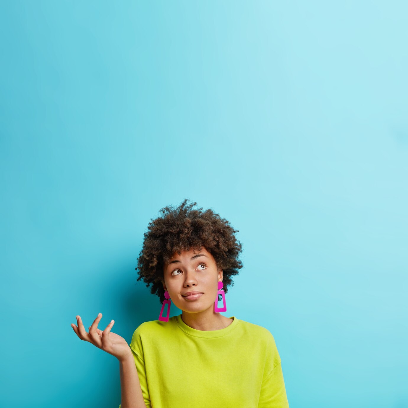 vertical shot doubtful afro american woman raises hand with doubt looks confused makes decision 273609 45593